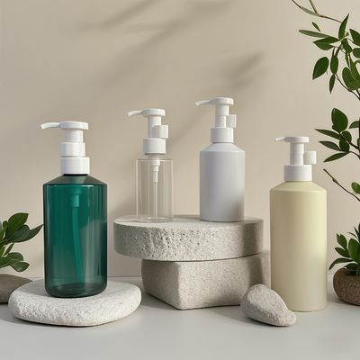 Botella con bomba de loción cilíndrica de PET de 300 ml-500 ml para envasado de cosméticos con impresión de logotipo personalizable