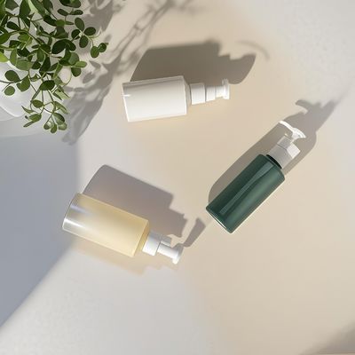 Botella con bomba de loción cilíndrica de PET de 300 ml-500 ml para envasado de cosméticos con impresión de logotipo personalizable
