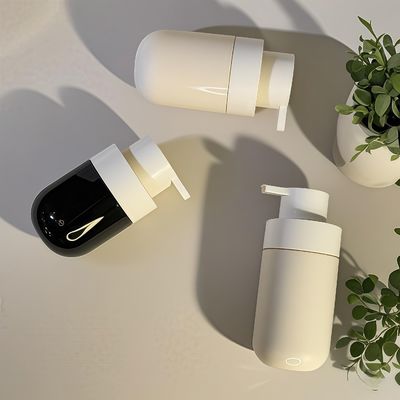 Botella cosmética PET de forma redonda y gruesa con bomba de presión e impresión serigráfica a color personalizado para embalaje de belleza